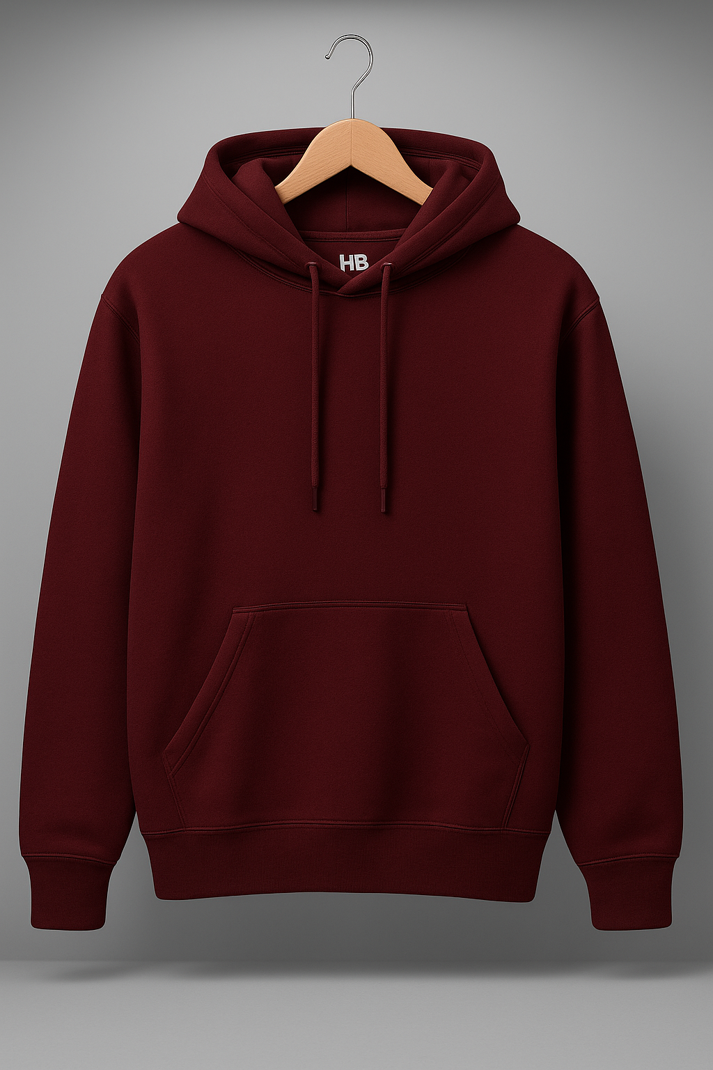 Maroon hoodie on a wooden hanger against a gray background